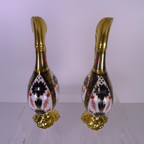 391 - A pair of Royal Crown Derby old Imari 1128 Swan neck pitchers, 26cm tall, with boxes