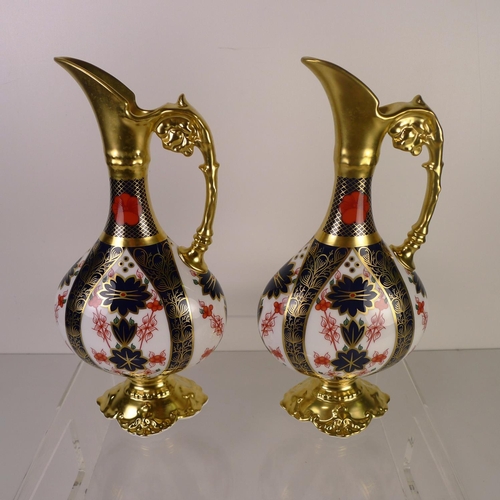 391 - A pair of Royal Crown Derby old Imari 1128 Swan neck pitchers, 26cm tall, with boxes