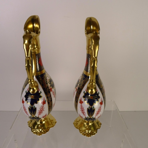 391 - A pair of Royal Crown Derby old Imari 1128 Swan neck pitchers, 26cm tall, with boxes