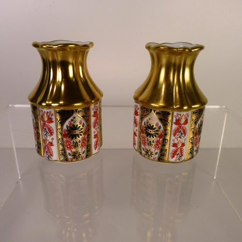 393 - A pair of Royal Crown Derby old Imari 1128 primrose vases, 8cm tall