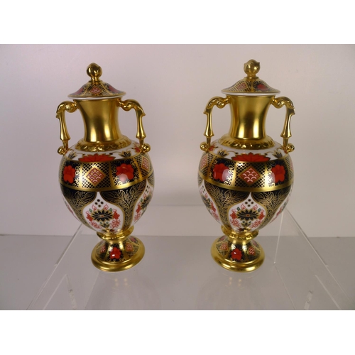 401 - A pair of Royal Crown Derby old Imari 1128 Sudbury vases with covers, 20cm tall, with boxes