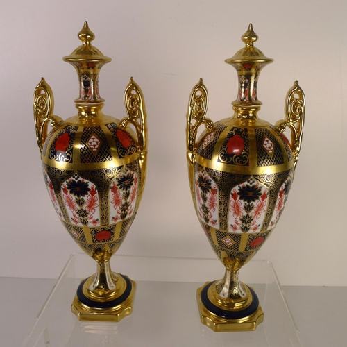 411 - A pair of Royal Crown Derby old Imari 1128 trophy vases, 31cm tall, with boxes