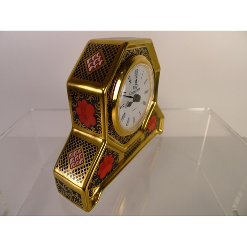 413 - A Royal Crown Derby old Imari 1128 mantel clock, 11cm tall, with box