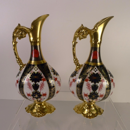 425 - A pair of Royal Crown Derby old Imari 1128 swan neck pitchers, 26 cm tall, with boxes