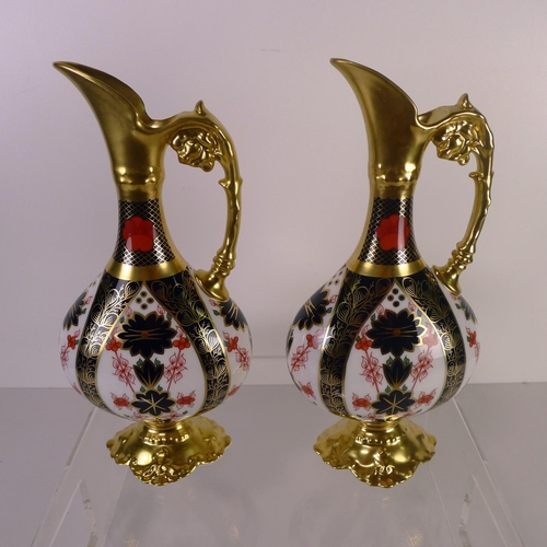 425 - A pair of Royal Crown Derby old Imari 1128 swan neck pitchers, 26 cm tall, with boxes