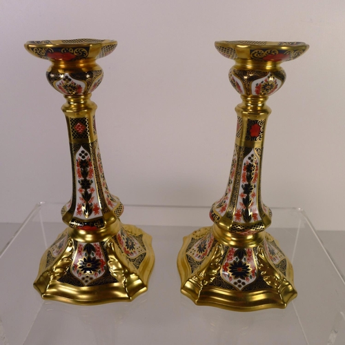 427 - A pair of Royal Crown Derby old Imari 1128 Castleton candle sticks, 18cm tall