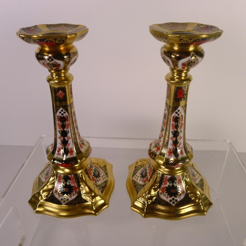 427 - A pair of Royal Crown Derby old Imari 1128 Castleton candle sticks, 18cm tall