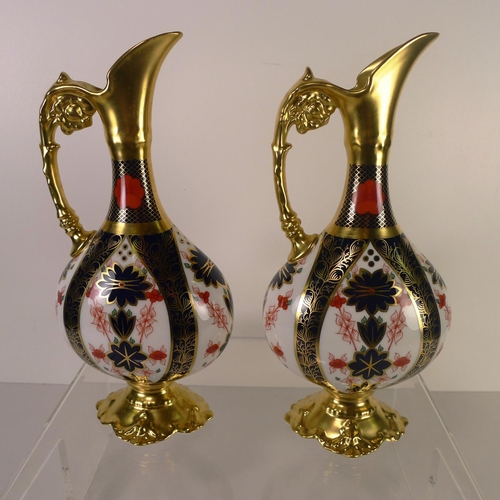 440 - A pair of Royal Crown Derby old Imari 1128 swan neck pitchers, 26cm tall, with boxes