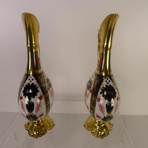 440 - A pair of Royal Crown Derby old Imari 1128 swan neck pitchers, 26cm tall, with boxes