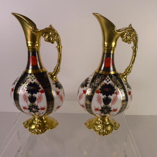 440 - A pair of Royal Crown Derby old Imari 1128 swan neck pitchers, 26cm tall, with boxes