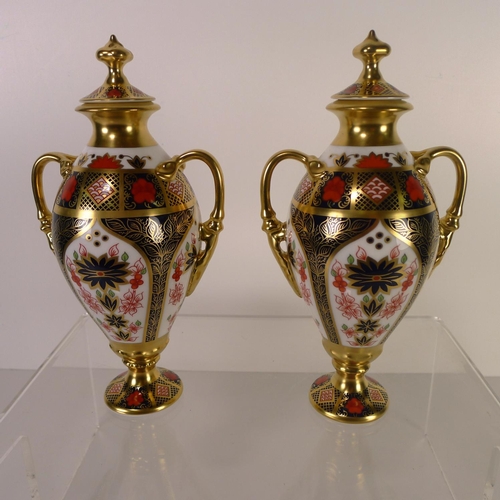 444 - A pair of Royal Crown Derby old Imari 1128 Tissington vases with lids, 20cm tall, with boxes