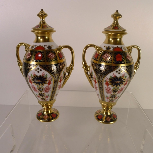 444 - A pair of Royal Crown Derby old Imari 1128 Tissington vases with lids, 20cm tall, with boxes