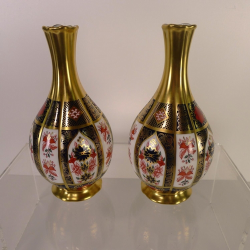 446 - A pair of Royal Crown Derby old Imari 1128 orchid vases, 17cm tall, with boxes