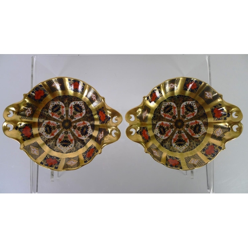 448 - A pair of Royal Crown Derby old Imari 1128 circular baskets, 16cm diameter