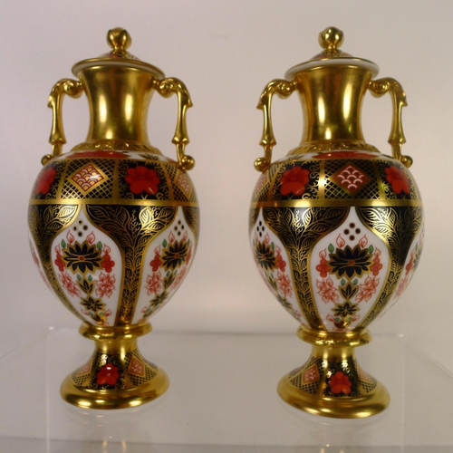 450 - A pair of Royal Crown Derby old Imari 1128 Sudbury vases with lids, 20cm tall, with boxes