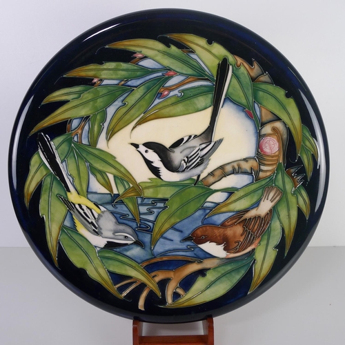 459 - A pair of modern Moorcroft pottery cabinet plates, 35cm diameter, decorated with birds & foliage, im... 