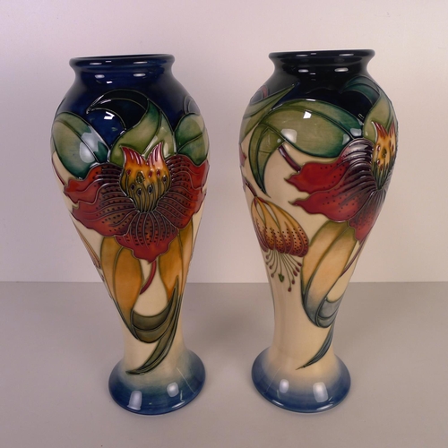 465 - A pair of modern Moorcroft pottery vases, 28cm tall, decorated with flower & foliage, impressed & pa... 