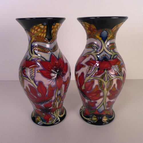 466 - A pair of modern Moorcroft pottery vases, 19cm tall, decorated with flowers & foliage, impressed & p... 