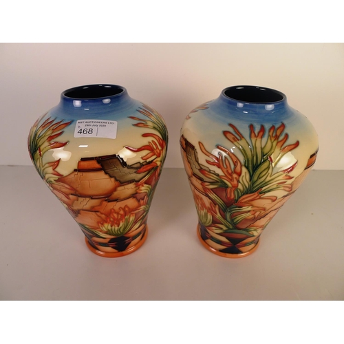 468 - A pair of modern Moorcroft pottery vases, 22cm tall, decorated with stonework & foliage, impressed &... 