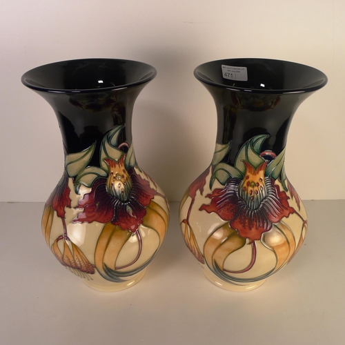 471 - A pair of modern Moorcroft pottery vases, 33cm tall, decorated with flowers & foliage, impressed & p... 