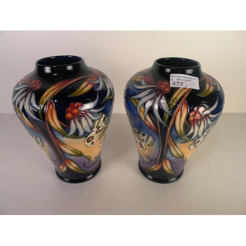 472 - A pair of modern Moorcroft pottery vases, 22cm tall, decorated with butterflies & foliage, impressed... 