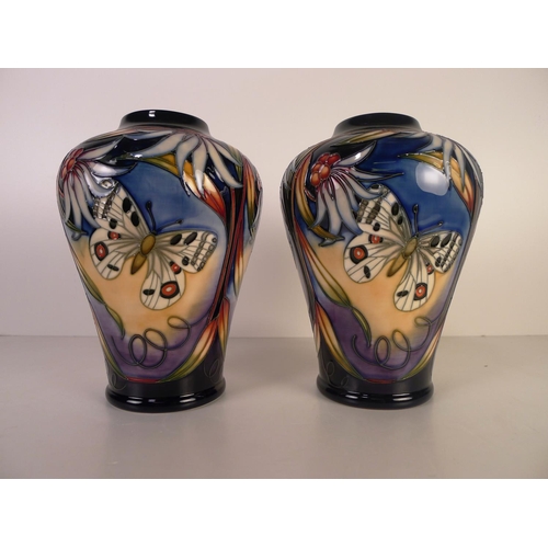 472 - A pair of modern Moorcroft pottery vases, 22cm tall, decorated with butterflies & foliage, impressed... 