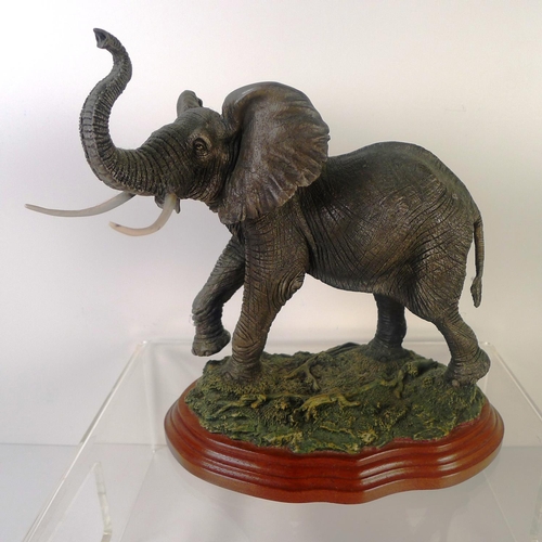 62 - A resin elephant, 23cm tall