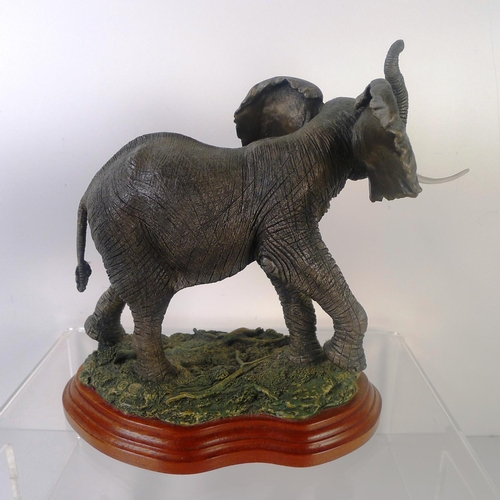 62 - A resin elephant, 23cm tall