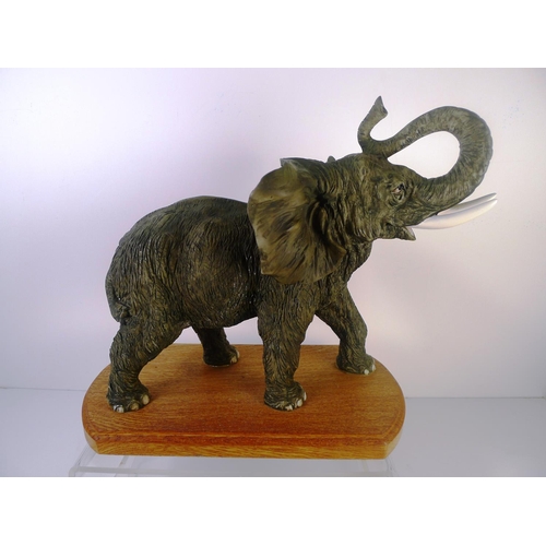 71 - A resin elephant, 33cm tall