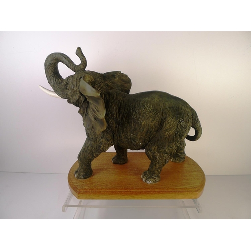 71 - A resin elephant, 33cm tall