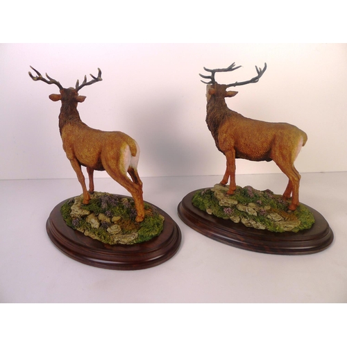 73 - A pair of Country Artists red stags, 18cm tall