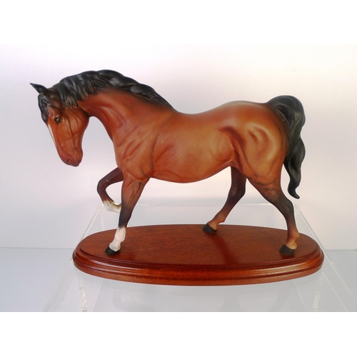 84 - A Beswick horse on plinth, 20cm tall