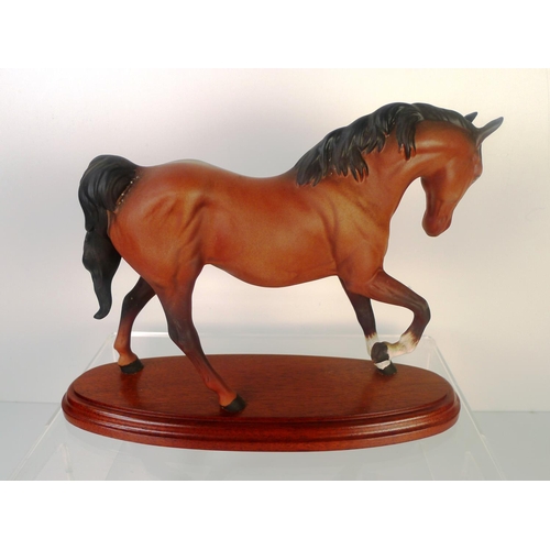 84 - A Beswick horse on plinth, 20cm tall