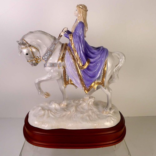 128 - A Royal Worcester figurine of a lady on a horse 