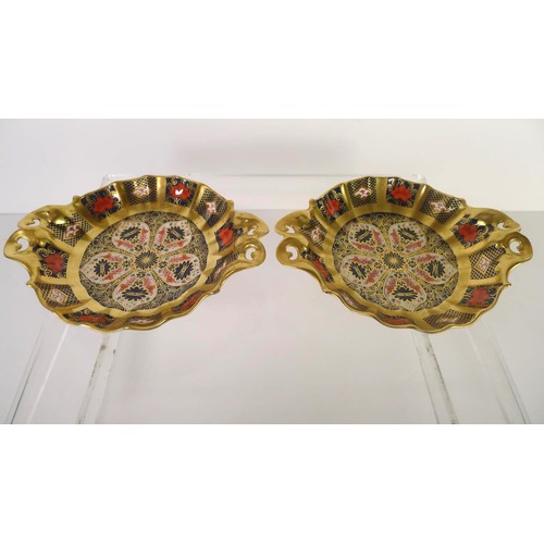 448 - A pair of Royal Crown Derby old Imari 1128 circular baskets, 16cm diameter