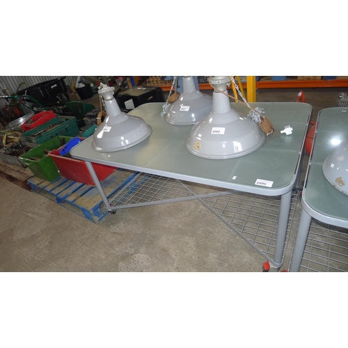 2095 - 1 grey metal wheeled table with opaque glass top and partial metal mesh shelf below, approx 140cm x ... 