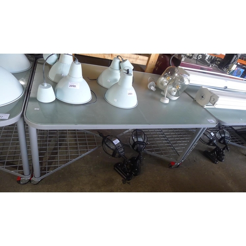 2098 - 1 grey metal wheeled table with opaque glass top and partial metal mesh shelf below, approx 140cm x ... 