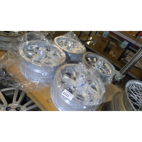 2222 - 4 unused MINILITE 13 x 6 inch alloy wheels with centre caps - to suit Ford