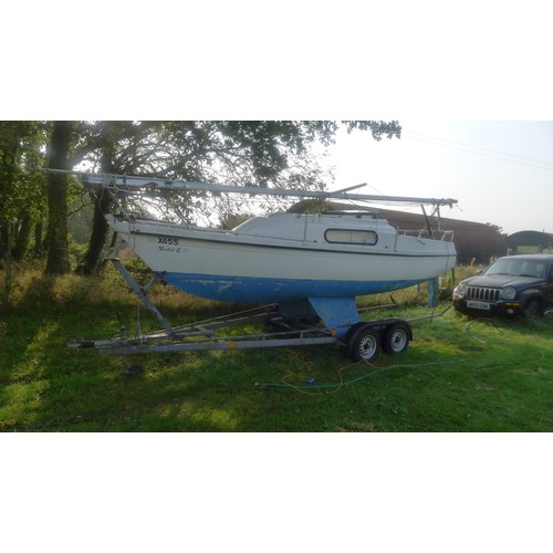 2395 - A Pandora 700 23ft bilge keel GRP Bermudan sloop, 4 berths with 7.5hp o/b engine and a twin axle roa... 