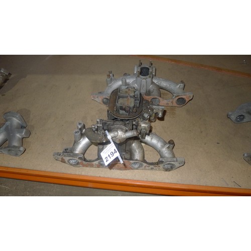 2194 - 2 manifolds both believed to fit Ford Pinto engines, 1 of which has a twin choke Webber carburettor ... 