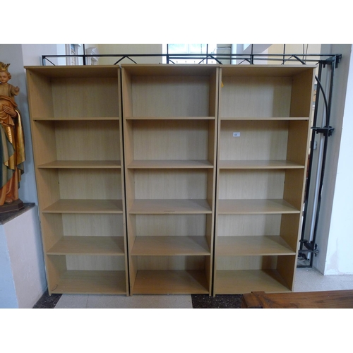 369 - Three modern light wood finished open fronted freestanding bookcases