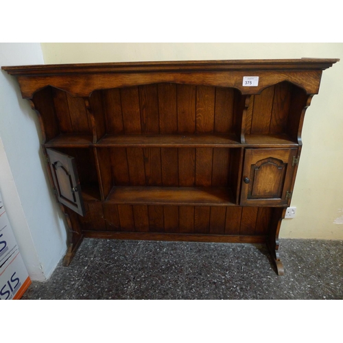 375 - An oak open fronted dresser top