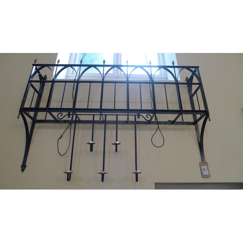 380 - A decorative wrought iron window box, approximately 145cm wide