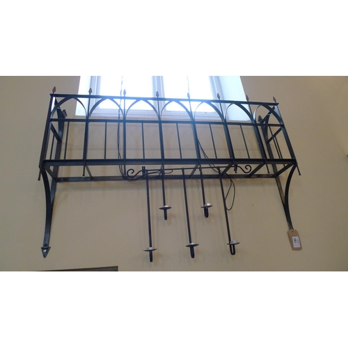 381 - A decorative wrought iron window box, approximately 145cm wide