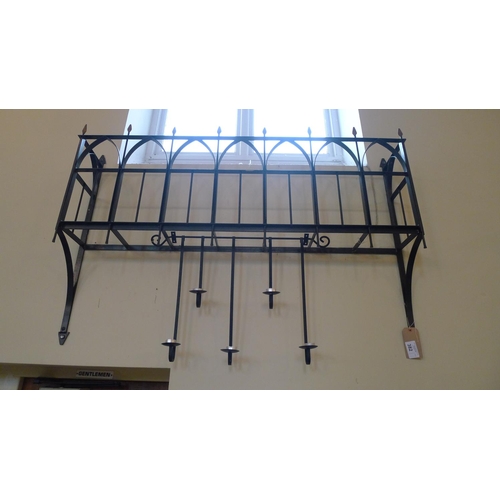 382 - A decorative wrought iron window box, approximately 145cm wide