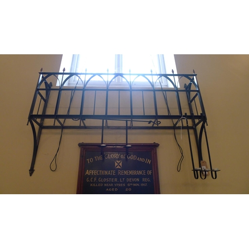 384 - A decorative wrought iron window box, approximately 145cm wide