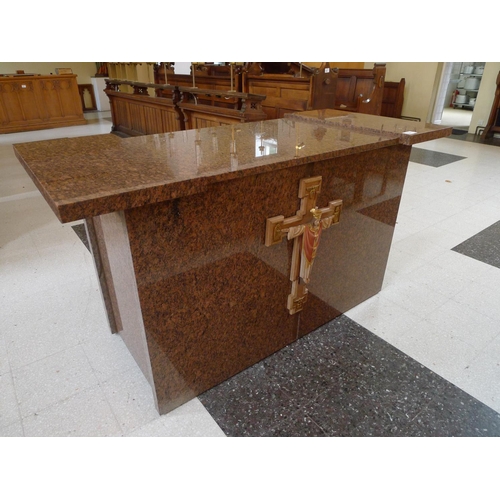 397 - A mottled granite altar unit with crucifix to front, approximately 175cms wide