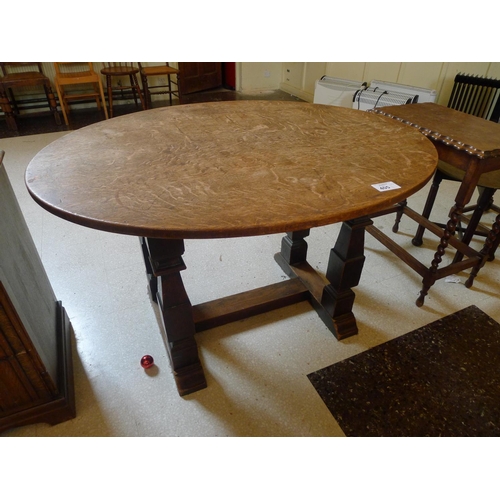 405 - An oak oval topped centre table with square legs