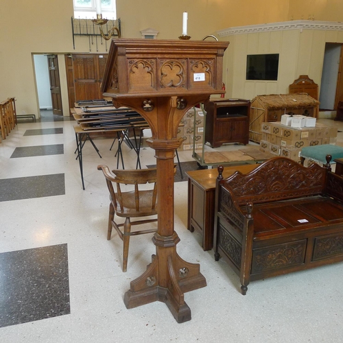 418 - A carved oak ecclesiastical style lectern with brass candle holders 156cm high, approx 60cm x 60cm s... 