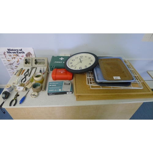 425 - A quantity of various items including pin boards, a clock, a first aid kit, a burns kit, a calculato... 